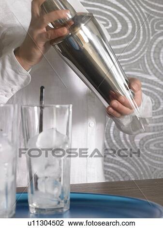 Cocktail bar and bar tender View Large Photo Image Stock Image - Cocktail bar and bar tender. Fotosearch