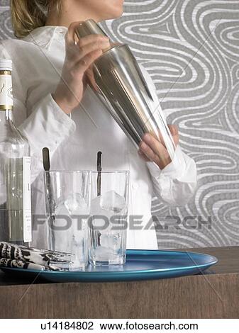 Cocktail bar and bar tender View Large Photo Image Stock Image - Cocktail bar and bar tender. Fotosearch