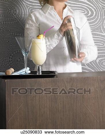 Cocktail bar and bar tender View Large Photo Image Stock Image - Cocktail bar and bar tender. Fotosearch