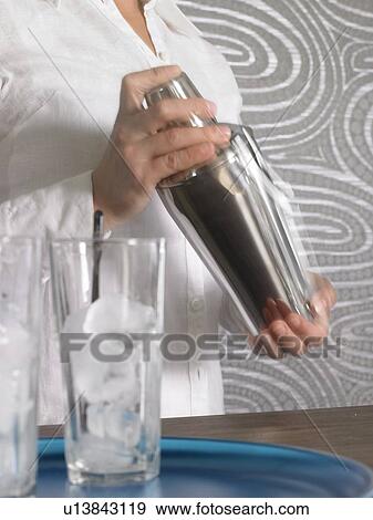 Cocktail bar and bar tender View Large Photo Image Stock Photo - Cocktail bar and bar tender. Fotosearch