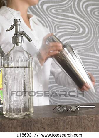 Stock Photo - Cocktail bar and bar tender. Fotosearch