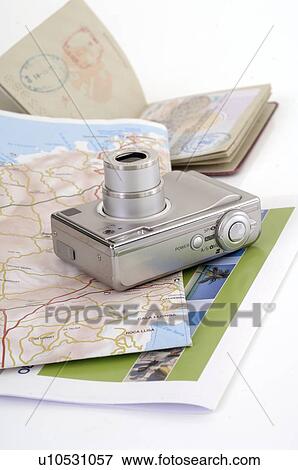 Stock Photo - Camera, passport and a map. Fotosearch