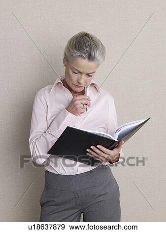 Stock Photo - Senior adult with datebook. Fotosearch