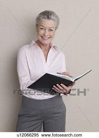 Senior adult with datebook View Large Photo Image Stock Photography - Senior adult with datebook. Fotosearch