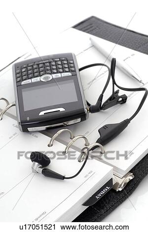 Smartphone and a date book View Large Photo Image Stock Image - Smartphone and a date book. Fotosearch