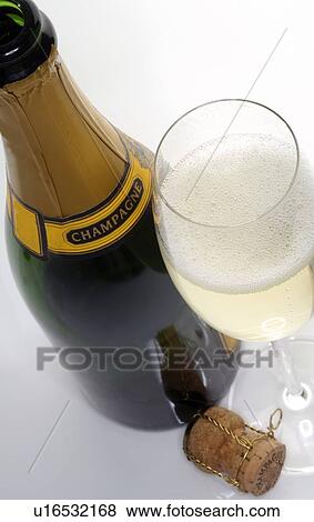 Stock Photo - Champagne bottle and glass. Fotosearch