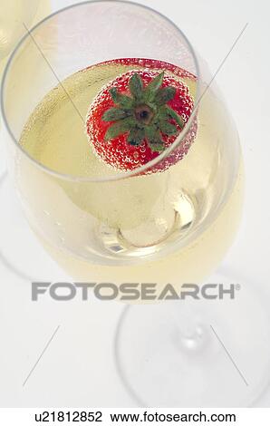 Stock Image - Champagne with a strawberry. Fotosearch