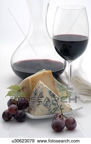Decanting carafe, wine glass, cheese and grapes View Large Photo Image Stock Photo - Decanting carafe, wine glass, cheese and grapes. Fotosearch
