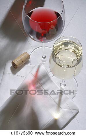 Stock Image - Glasses of red and white wine. Fotosearch