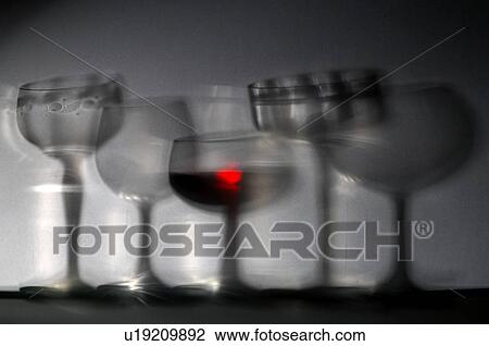 Stock Image - Glasses of wine, blurred. Fotosearch