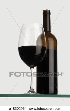 Red wine bottle and glass View Large Photo Image Picture - Red wine bottle and glass. Fotosearch