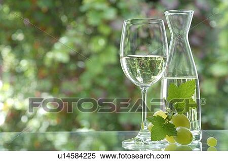 White wine in a carafe, wine glass and red wine grapes View Large Photo Image Stock Photography - White wine in a carafe, wine glass and red wine grapes. Fotosearch
