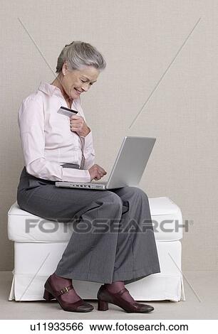 Senior adult in business clothing with laptop View Large Photo Image Stock Photograph - Senior adult in business clothing with laptop. Fotosearch