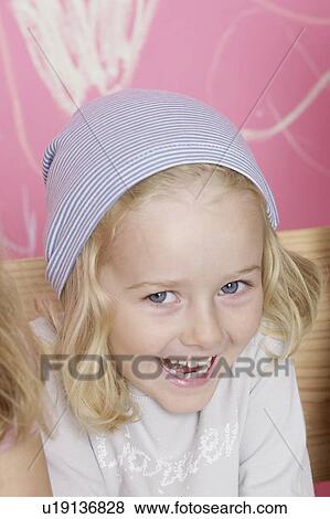 Stock Photo - Blond girl wearing a headscarf. Fotosearch