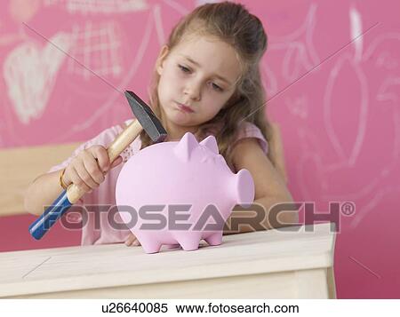 Blonde girl with hammer and piggy bank View Large Photo Image Stock Photography - Blonde girl with hammer and piggy bank. Fotosearch