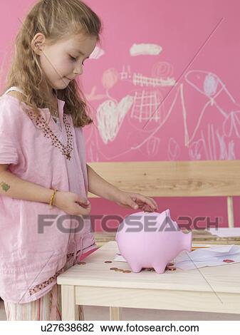 Blonde girl with money and piggy bank View Large Photo Image Stock Image - Blonde girl with money and piggy bank. Fotosearch