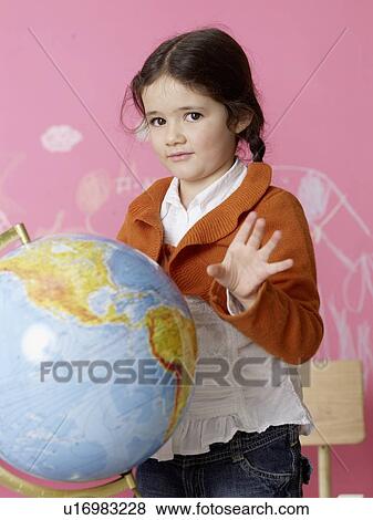 Stock Photo - Girl with a globe. Fotosearch
