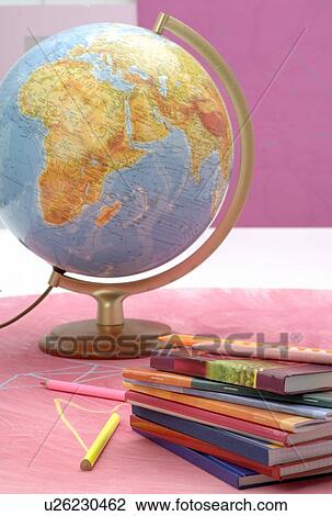 Stock Image - Globe, notebooks and crayons. Fotosearch