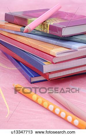 Stock Image - Notebooks and crayons. Fotosearch