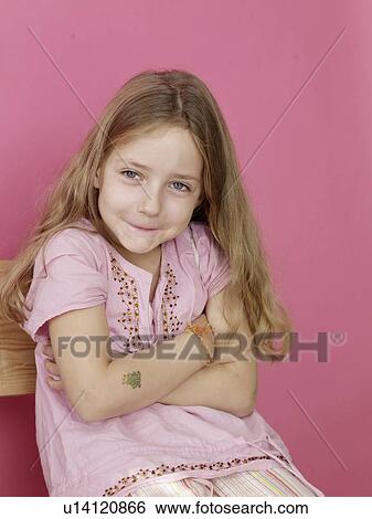 Stock Photograph - Sitting blonde girl. Fotosearch