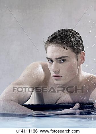 Man at the edge of a pool View Large Photo Image Stock Photograph - Man at the edge of a pool. Fotosearch