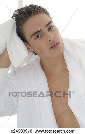 Stock Photo - Man wearing bathrobe with towel. Fotosearch