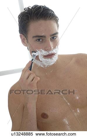 Stock Photography - Man wet shaving. Fotosearch