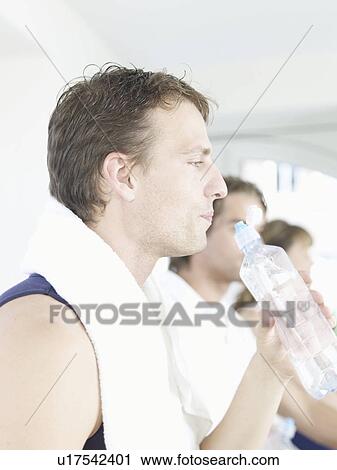 Man with a bottle of water View Large Photo Image Stock Image - Man with a bottle of water. Fotosearch