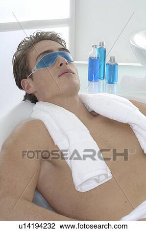 Stock Image - Man with a gel mask. Fotosearch