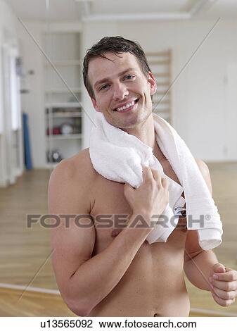 Man with a towel around his neck View Large Photo Image Stock Image - Man with a towel around his neck. Fotosearch