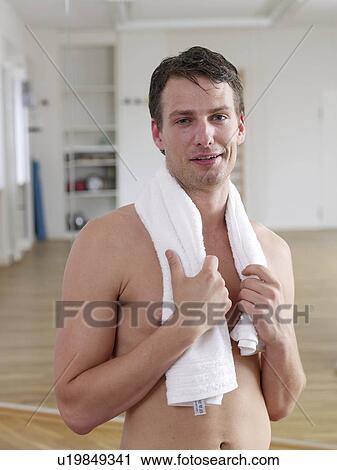 Stock Image - Man with a towel around his neck. Fotosearch