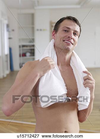 Man with a towel around his neck View Large Photo Image Stock Photo - Man with a towel around his neck. Fotosearch