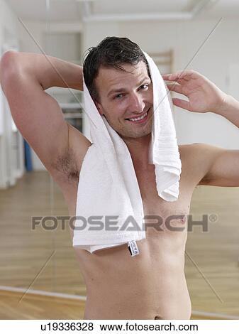 Stock Photo - Man with a towel around his neck. Fotosearch