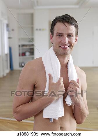 Stock Photography - Man with a towel around his neck. Fotosearch