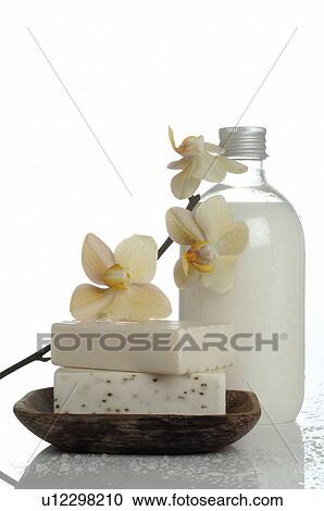 Stock Image - Men's Spa: Small bottle and soap bar. Fotosearch