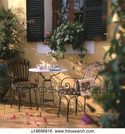 Mediterranean style breakfast table on terrace View Large Photo Image Stock Photograph - Mediterranean style breakfast table on terrace. Fotosearch