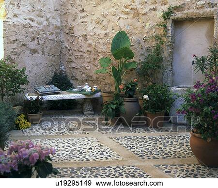 Stock Photo - Patio with terracotta vases. Fotosearch