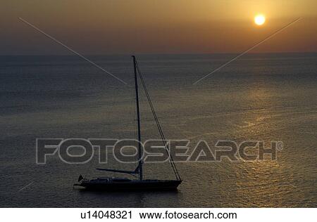Stock Image - Sailship in sunset. Fotosearch