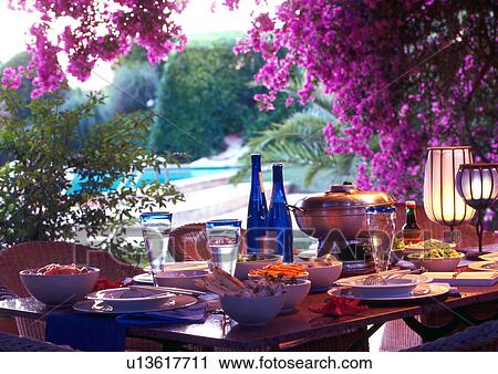 Summery table setting beneath bougainvillea View Large Photo Image Stock Image - Summery table setting beneath bougainvillea. Fotosearch