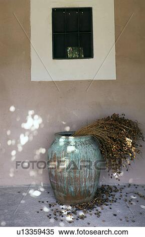 Stock Photography - Terracotta vase with dates. Fotosearch