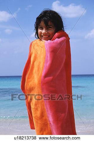 Child at the sea with a towel View Large Photo Image Stock Photo - Child at the sea with a towel. Fotosearch