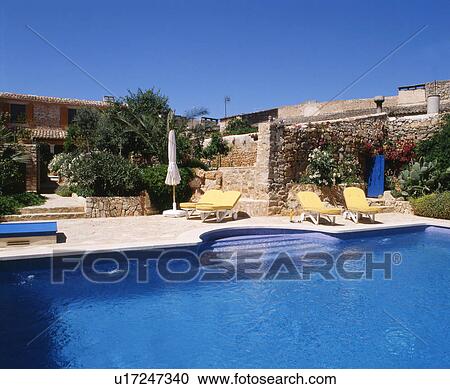 Stock Image - Mediterranean house with swimming pool. Fotosearch