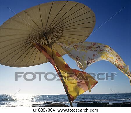 On the beach: Parasol View Large Photo Image Picture - On the beach: Parasol. Fotosearch