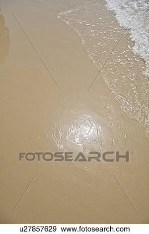 Stock Photo - Sea water on the beach. Fotosearch