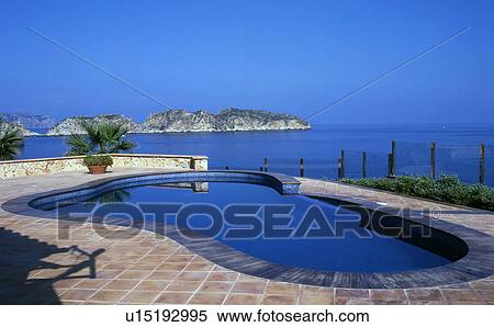 Stock Photography - Swimming pool at the sea. Fotosearch