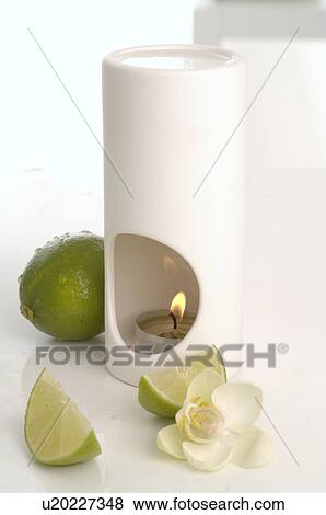 Aroma lamp, limes and orchid blossoms View Large Photo Image Stock Photo - Aroma lamp, limes and orchid blossoms. Fotosearch