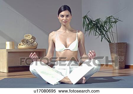 Woman doing yoga exercise View Large Photo Image Stock Photography - Woman doing yoga exercise. Fotosearch