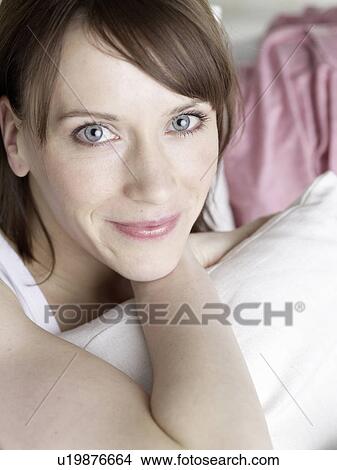 Woman on sofa View Large Photo Image Picture - Woman on sofa. Fotosearch