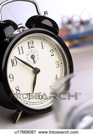 Stock Photo - black alarmclock. Fotosearch
