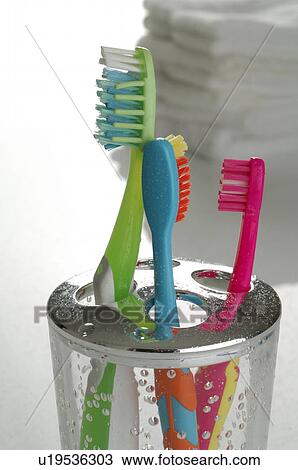 Stock Image - coloured toothbrushes. Fotosearch